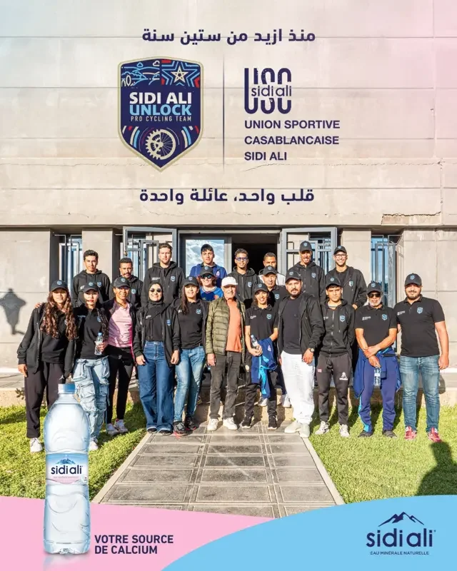 SIDI ALI UNLOCK team and club members together outside the club building